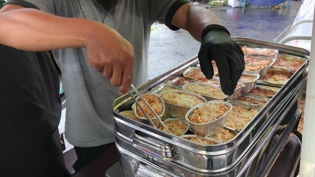 Shoppers buy Zuppa Soup on Car Free Day. Buyer chooses food.
