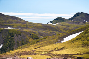 Hiking trail through alpine meadow. Beautiful landscape in the summer time. Kamchatka peninsula