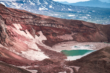 Emerald lake in the crater of the volcano. Summer landscape, Kamchatka peninsula