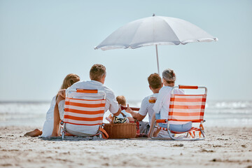 Beach, umbrella and big family on a summer vacation, trip or seaside journey together in Australia....