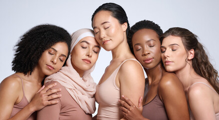 Obraz premium Face, beauty and group of women with eyes closed in studio isolated on gray background. Diversity, skincare cosmetics or makeup of girls, female models or friends posing for inclusion or self love.