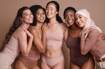 Diversity, women and body positive support in studio for body care wellness, beauty and skincare portrait. Interracial, group of people and cosmetics self care dermatology for models in underwear