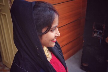 portrait of a woman smiling, standing, indian girl 