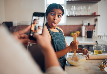 Funny child, phone and baking in home with mother taking photo for social media or food blog post...