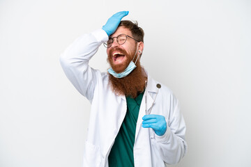 Dentist reddish man holding tools isolated on white background has realized something and intending...