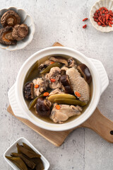 Delicious Taiwanese peeled green chili pepper chicken soup with mushroom and goji berry.