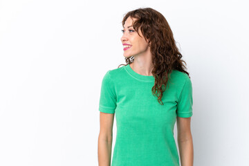 Young woman with curly hair isolated on white background looking side