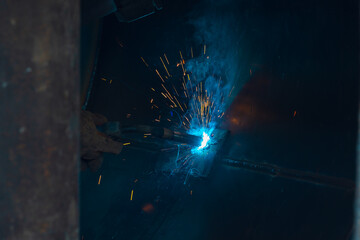 Welder building technical, industrial steel welder in technical workshop, craftsman, industrial steel welder, technical steel in technical factory, Welding of steel, sparking,light color like firework