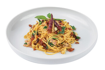 Png Spaghetti with bacon, dried chillies and Thai herbs on a white plate