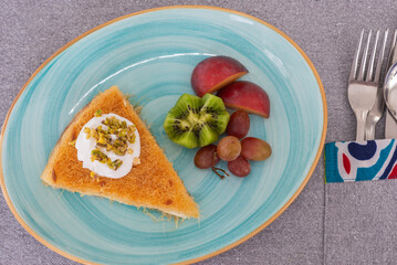 Basbousa a la carte meal dessert with fresh fruit