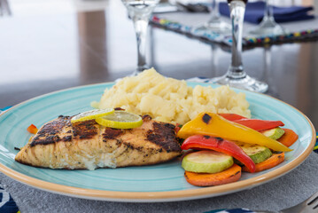 Salmon steak a la carte meal with vegetables