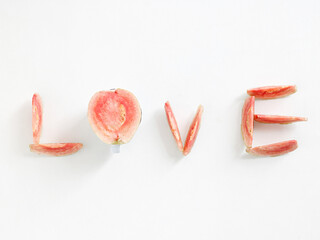 guava fuit arranged in the shape of love