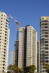 Expensive modern real estate. Beautiful residential buildings surrounded by greenery. The concept of mortgage, real estate on credit, investment.