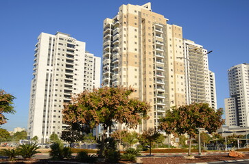 Expensive modern real estate. Beautiful residential buildings surrounded by greenery. The concept of mortgage, real estate on credit, investment.