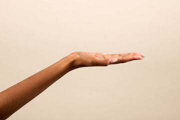 Crop black female demonstrating empty space