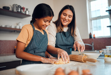 Baking, family and love with a daughter and mother teaching a girl about cooking baked goods in a...