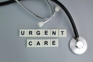 stethoscope and alphabet letters with the word Urgent Care. medical and health concepts