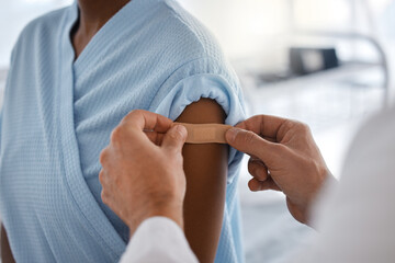 Healthcare, vaccination and patient with plaster from doctor in consultation room of hospital....