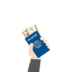 hand holding airplane ticket and passport