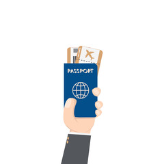 hand holding airplane ticket and passport