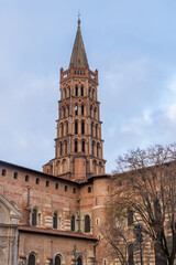 Fototapeta premium Vertical landscape view of landmark medieval St Sernin basilica belltower, Toulouse, France