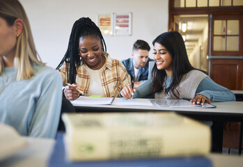 Students, women and studying in classroom, happy and conversation to prepare for examination,...