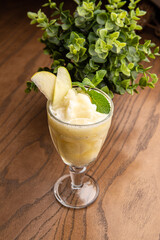 Cocktail with apple, sherbet and mint