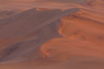 Desert off the coast of the Atlantic Ocean. Beautiful sunset. Walvis Bay. Swakopmund, Namibia.