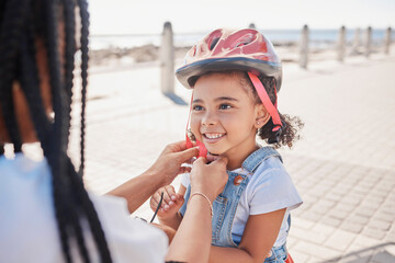 Mother, child and helmet for bicycle, park and help with love, bonding and happiness by ocean in...