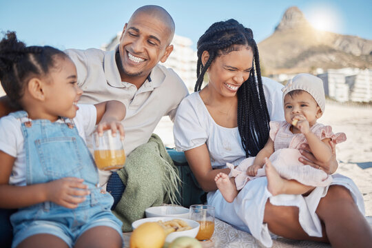 Black Family, Happy And Food Picnic On Beach With Kids To Enjoy Summer Outing Together In Cape Town, South Africa. Children, Mother And Dad Relax On Sand In Nature For Bonding In Sunshine.