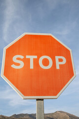 Red Stop Sign against Blue Sky