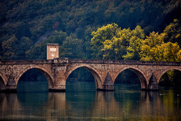 Fototapeta premium Bridge on river Drina, famous historic Ottoman architecture in Visegrad, Bosnia and Herzegovina.