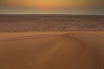 Desert off the coast of the Atlantic Ocean. Beautiful sunset. Walvis Bay. Swakopmund, Namibia.
