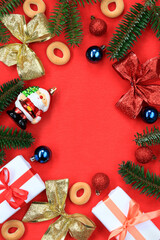 Christmas composition on a red background, top view. Frame from New Year's decor, flat lay, top view