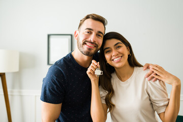 Portrait of a couple showing their new house keys