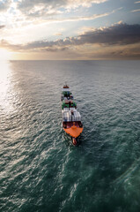 Obraz premium Impressive aerial wide angle view of a container ship crossing the oceans