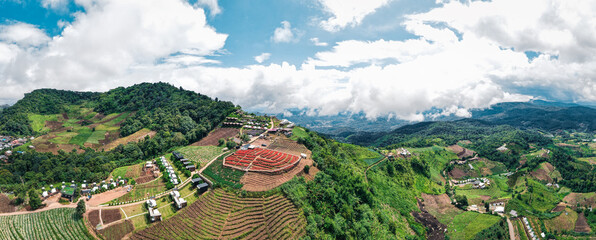 Drone panorama over the hill in north of Thailand. Red flower farm on the top of mountain