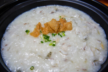 A pot of delicious fish porridge close-up
