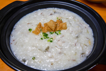 A pot of delicious fish porridge close-up