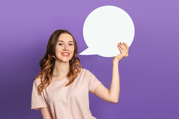 ukrainian student girl holds white paper card speech bubble isolated over purple background
