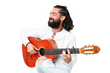 Young man with beard with guitar over isolated chroma key background