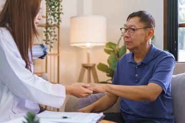 Fototapeta premium Health concept, Woman caregiver touch hand to encourage senior man after telling result of health