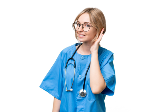 Young nurse English woman over isolated background listening to something by putting hand on the ear