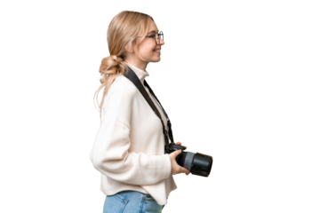 Young photographer English woman over isolated background in lateral position