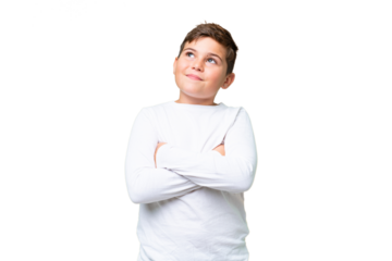 Little caucasian kid over isolated chroma key background looking up while smiling