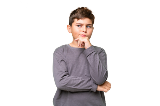 Little caucasian kid over isolated chroma key background having doubts and thinking