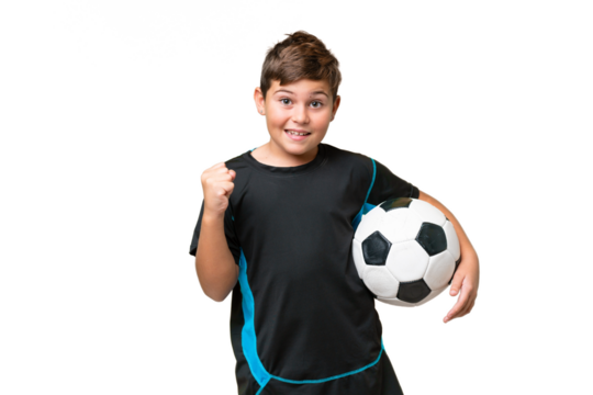 Little caucasian football player kid over isolated chroma key background celebrating a victory in winner position