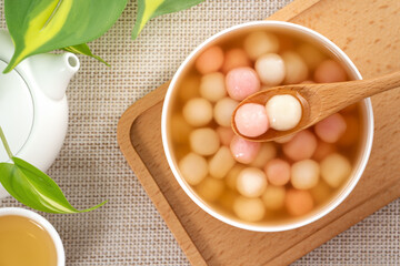 Red and white tangyuan with syrup soup.