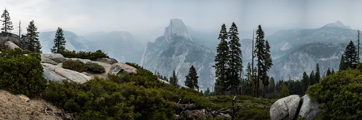 Fotobehang Panorama of Glacier Point View With Forest Fire Smoke Filling The Valley © kellyvandellen