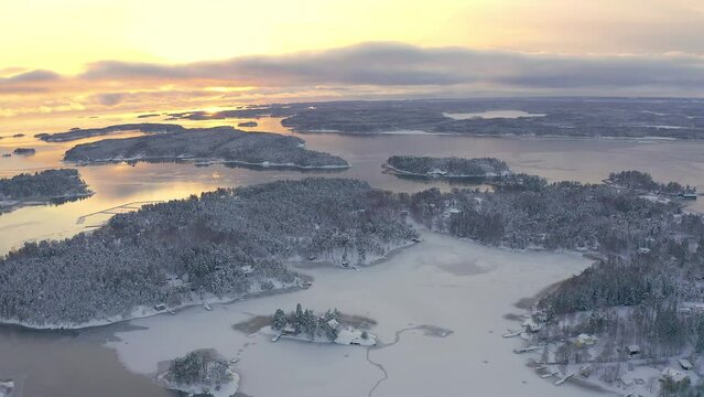 Soukka, Finland - 09.12.22: panoramic shooting of the winter archipelago from a drone in Soukka, Espoo.
Sunset on a winter day. Finnish winter. Scandinavia.